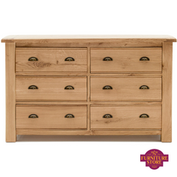 The breeze 6 drawer chest comes in solid oak and has two handles on each drawer with half moon style brass handles.